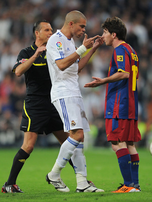 MADRID, SPAIN - APRIL 16: Pepe (L) of Real Madrid argues with Lionel Messi of Barcelona during the la Liga match between Real Madrid and Barcelona at Estadio Santiago Bernabeu on April 16, 2011 in Madrid, Spain. (Photo by Jasper Juinen/Getty Images)