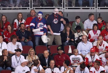 GLENDALE, AZ - APRIL 20:  Fans dressed in Winnipeg Jets uniforms attend Game Four of the Western Conference Quarterfinals between the Detroit Red Wings and the Phoenix Coyotes during the 2011 NHL Stanley Cup Playoffs at Jobing.com Arena on April 20, 2011