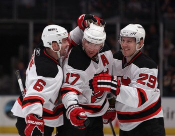 NEW YORK, NY - APRIL 09: Andy Greene #6, Ilya Kovalchuk #17, and Anssi Salmela #29 of the New Jersey Devils celebrate Kovalchuk's goal at 9:18 of the first period against the New York Rangers at Madison Square Garden on April 9, 2011 in New York City.  (P