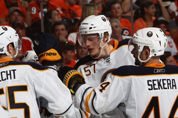 PHILADELPHIA, PA - APRIL 26:  Tyler Myers #57 of the Buffalo Sabres celebrates his third period goal against the Philadelphia Flyers with teammates Jochen Hecht #55 and Andrej Sekera #44 in Game Seven of the Eastern Conference Quarterfinals during the 201