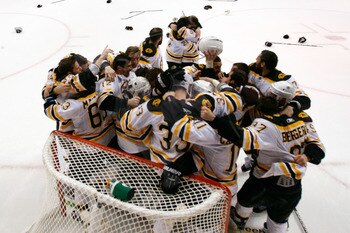 VANCOUVER, BC - JUNE 15:  Adam McQuaid #54 of the Boston Bruins celebrates with his teammates Brad Marchand #63, Tyler Seguin #19, Tim Thomas #30 and Zdeno Chara #33 after defeating the Vancouver Canucks in Game Seven of the 2011 NHL Stanley Cup Final at