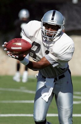NAPA, CA - JULY 30:  Tim Brown # 81 of the Oakland Raiders catches a pass on the first day of a two-week training camp July 30, 2004 in Napa, California.  (Photo by David Paul Morris/Getty Images)