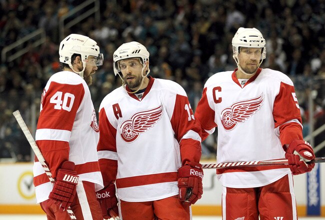 SAN JOSE, CA - MAY 12:  Henrik Zetterberg #40, Pavel Datsyuk #13, and Nicklas Lidstrom #5 of the Detroit Red Wings talk to each other before a face off against the San Jose Sharks in Game Seven of the Western Conference Semifinals during the 2011 NHL Stan