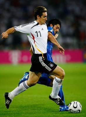 DORTMUND, GERMANY - JULY 04: Miroslav Klose of Germany tussles for posession with Gennaro Gattuso of Italy during the FIFA World Cup Germany 2006 Semi-final match between Germany and Italy played at the Stadium Dortmund on July 04, 2006 in Dortmund, Germa