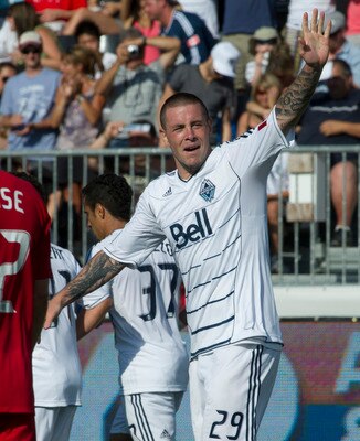 VANCOUVER, CANADA - AUGUST 7: Eric Hassli #29 of the Whitecaps FC waves to the crowd after scoring his second goal of the game during the second half of MLS Soccer on August 07, 2011 at Empire Field against the Chicago Fire in Vancouver, BC, Canada.  (Pho