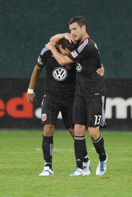 WASHINGTON, DC - AUGUST 6:  Chris Pontius #13 and Dwayne De Rosario of D.C. United celebrate their team's third goal during a soccer game against Toronto FC at RFK Stadium on August 6, 2011 in Washington, DC.  The game ended in 3-3 tie.  (Photo by Mitchel