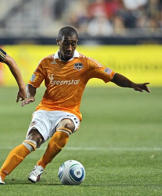 CHESTER, PA- AUGUST 06: Corey Ashe #26 of the Houston Dynamo keeps the ball away from Jack McInerney #19 of the Philadelphia Union at PPL Park on August 6, 2011 in Chester, Pennsylvania. (Photo by Drew Hallowell/Getty Images)
