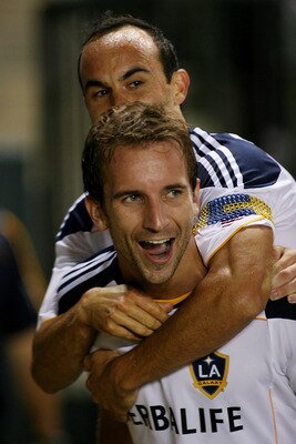 CARSON, CA - AUGUST 06:  Mike Magee #18 of the Los Angeles Galaxy celebrates his goal against FC Dallas with teammate Landon Donovan #10 at The Home Depot Center on August 6, 2011 in Carson, California.  (Photo by Jeff Golden/Getty Images)