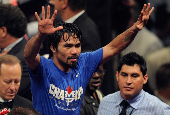 LAS VEGAS, NV - MAY 07:  Manny Pacquiao of the Philippines celebrates after his unanimous decision victory against Shane Mosley in the WBO welterweight title fight at MGM Grand Garden Arena on May 7, 2011 in Las Vegas, Nevada.  (Photo by Ethan Miller/Gett