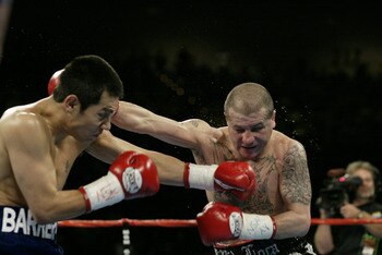 LAS VEGAS, NV - NOVEMBER 2:  Marco Antonio Barrera  (left ) and Johnny Tapia exchange blows during the featherweight championship fight at the MGM Grand Garden Arena on November 2, 2002 in Las Vegas, Nevada.  (Photo by Jed Jacobsohn/Getty Images)