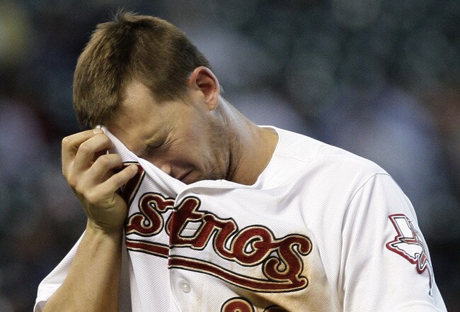HOUSTON, TX - JULY 20: Chris Johnson #23 of the Houston Astros wipes his brow after the Astros didn't score in the 8th inning leaving the bases loaded  on July 20, 2011 at Minute Maid Park in Houston, Texas. Astros won in the bottom of the 11th 3 to 2.(Ph