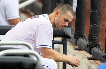 NEW YORK, NY - AUGUST 07:  David Wright #5 of the New York Mets sits in the dugout in the ninth inning against the Atlanta Braves at Citi Field on August 7, 2011 in the Flushing neighborhood of the Queens borough of New York City. The Braves defeated the