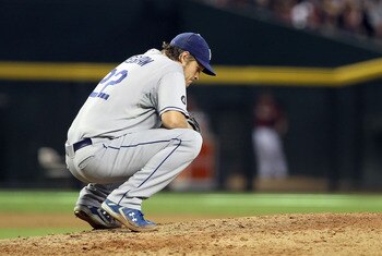 PHOENIX, AZ - AUGUST 07:  Starting pitcher Clayton Kershaw #22 of the Los Angeles Dodgers reacts after giving up a two run home run to Cody Ransom #1 (not pictured) of the Arizona Diamondbacks during the seventh inning of the Major League Baseball game at