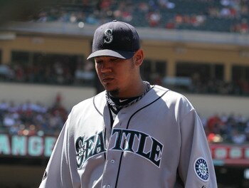 ANAHEIM, CA - AUGUST 07: Starting pitcher Felix Hernandez #34 of the Seattle Mariners walks off the field after finishing eight innings of work against the Los Angeles Angels of Anaheim on August 7, 2011 at Angel Stadium in Anaheim, California.  (Photo by