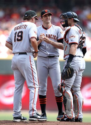 CINCINNATI, OH - JULY 31:  Dave Righetti the pitching coach of the San Francisco Giants talks with Barry Zito #75 and Eli Whiteside #22 during the game against the Cincinnati Reds at Great American Ball Park on July 31, 2011 in Cincinnati, Ohio.  (Photo b