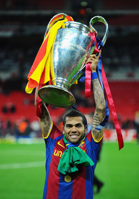 LONDON, ENGLAND - MAY 28:  Daniel Alves of FC Barcelona poses with the trophy after victory in the UEFA Champions League final between FC Barcelona and Manchester United FC at Wembley Stadium on May 28, 2011 in London, England.  (Photo by Clive Mason/Gett