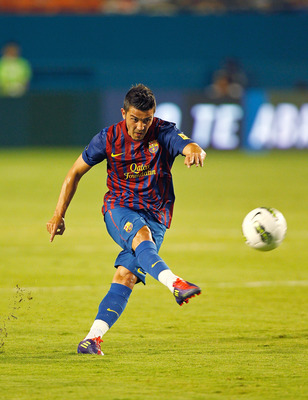 MIAMI GARDENS, FL - AUGUST 03: David Villa #7 of FC Barcelona takes a free kick during a game against CD Guadalajara during the 2011 World Football Challenge at Sun Life Stadium on August 3, 2011 in Miami Gardens, Florida.  (Photo by Mike Ehrmann/Getty Im