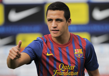 BARCELONA, SPAIN - JULY 25:  Alexis Sanchez from Chile poses during his presentation as the new signing for FC Barcelona at the Joan Gamper training camp sports complex on July 25, 2011 in Barcelona, Spain.  (Photo by David Ramos/Getty Images)