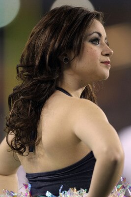 GLENDALE, AZ - JANUARY 01:  A Connecticut Huskies cheerleader performs during the Tostitos Fiesta Bowl against the Oklahoma Sooners at the Universtity of Phoenix Stadium on January 1, 2011 in Glendale, Arizona.  (Photo by Ronald Martinez/Getty Images)