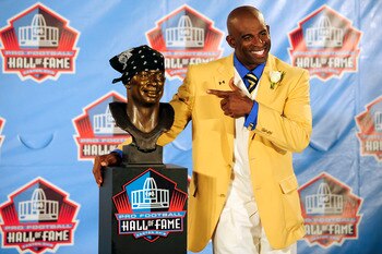 CANTON, OH - AUGUST 6:  Former Atlanta Falcons cornerback Deion Sanders poses with his bust at the Enshrinement Ceremony for the Pro Football Hall of Fame on August 6, 2011 in Canton, Ohio.  (Photo by Jason Miller/Getty Images)