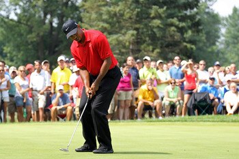AKRON, OH - AUGUST 07:  Tiger Woods putts during the final round of the World Golf Championships-Bridgestone Invitational on the South Course at Firestone Country Club on August 7, 2011 in Akron, Ohio.  (Photo by Andy Lyons/Getty Images)