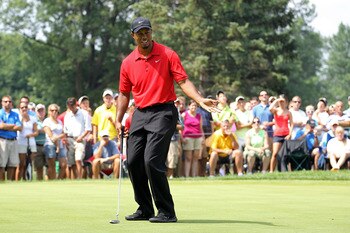 AKRON, OH - AUGUST 07:  Tiger Woods reacts to a putt during the final round of the World Golf Championships-Bridgestone Invitational on the South Course at Firestone Country Club on August 7, 2011 in Akron, Ohio.  (Photo by Andy Lyons/Getty Images)