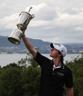 BELFAST, NORTHERN IRELAND - JUNE 22:  US Open winning golfer Rory McIlroy poses with his trophy on a green at Holywood Golf Club on June 22, 2011 in Belfast, Northern Ireland. The 22 year old golfer has returned home to his native Northern Ireland and is
