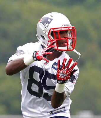 FOXBOROUGH, MA  - JULY 29:  Chad Ochocinco #85 of the New England Patriots catches a pass during the afternoon session of training camp at Gillette Stadium on July 29, 2011 in Foxborough, Massachusetts.  (Photo by Jim Rogash/Getty Images)