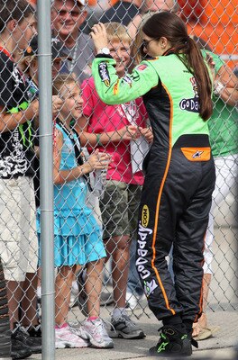 NEWTON, IA - JUNE 24:  Danica Patrick, driver of the #7 Team GoDaddy Dallara Honda, talks with fans during qualifying for the Iowa Corn Indy 250 on June 24, 2011 at Iowa Speedway in Newton, Iowa.  (Photo by Jamie Squire/Getty Images)