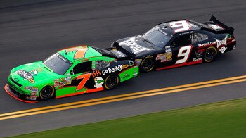 DAYTONA BEACH, FL - JULY 01:  Danica Patrick, driver of the #7 GoDaddy.com Chevrolet, races with Tony Stewart, driver of the #9 Tapout Chevrolet,during the NASCAR Nationwide Series Subway Jalapeno 250 Powered by Coca-Cola at Daytona International Speedway