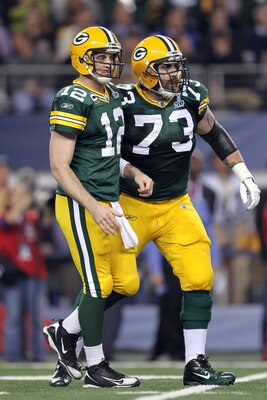 ARLINGTON, TX - FEBRUARY 06:  Aaron Rodgers #12 and Daryn Colledge #73 of the Green Bay Packers look on against the Pittsburgh Steelers during Super Bowl XLV at Cowboys Stadium on February 6, 2011 in Arlington, Texas. The Packers won 31-25. (Photo by Jami