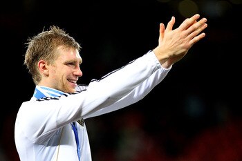 PORT ELIZABETH, SOUTH AFRICA - JULY 10:  Per Mertesacker of Germany celebrates victory and third place following the 2010 FIFA World Cup South Africa Third Place Play-off match between Uruguay and Germany at The Nelson Mandela Bay Stadium on July 10, 2010
