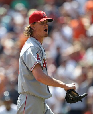 DETROIT - JULY 31:  Jered Weaver #36 of the Los Angeles Angels of Anaheim yells into the Tigers dugout after being throw out of the game by homeplate umpire Hunter Wendelstedt for throwing a pitch close to Alex Avila #13 of the   Detroit Tigers after Carl