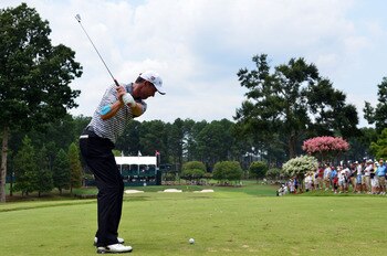 JOHNS CREEK, GA - AUGUST 09:  Padraig Harrington of Ireland hits a tee shot during a practice round prior to the start of the 93rd PGA Championship at the Atlanta Athletic Club on August 9, 2011 in Johns Creek, Georgia.  (Photo by Stuart Franklin/Getty Im