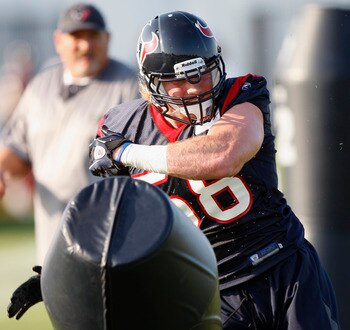 HOUSTON, TX - AUGUST 01:  Linebacker Brooks Reed #58 of the Houston Texans hits the tackling dummy during practice on the first day of training camp at Reliant Park on August 1, 2011 in Houston, Texas.  (Photo by Bob Levey/Getty Images)