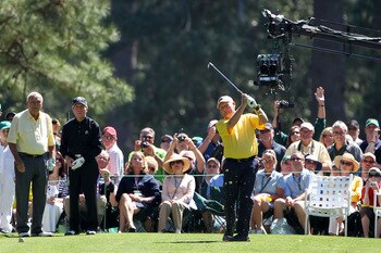 AUGUSTA, GA - APRIL 06:  Jack Nicklaus hits his tee shot on the first hole as Gary Player and Arnold Palmer look on during the Par 3 Contest prior to the 2011 Masters Tournament at Augusta National Golf Club on April 6, 2011 in Augusta, Georgia.  (Photo b