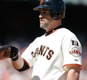 SAN FRANCISCO - AUGUST 26: Shortstop Rich Aurilla #35 of the San Francisco Giants gets a fist bump after delivering the game-winning hit during a Major League Baseball game against the Milwaukee Brewers on August 26, 2007 at AT&T Park in San Francisco, Ca