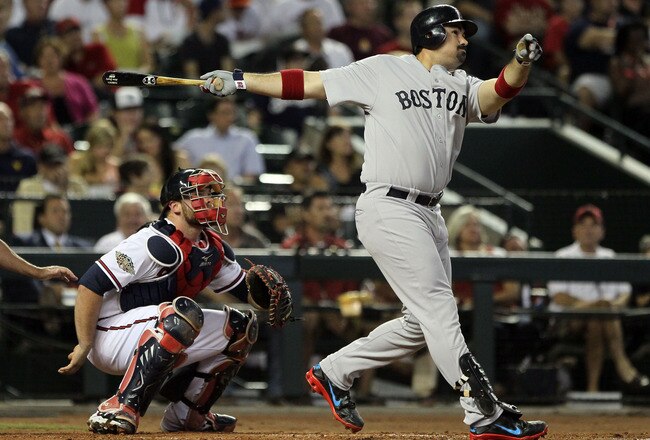 PHOENIX, AZ - JULY 12:  American League All-Star Adrian Gonzalez #28 of the Boston Red Sox hits a home run in the fourth inning of the 82nd MLB All-Star Game at Chase Field on July 12, 2011 in Phoenix, Arizona.  (Photo by Jeff Gross/Getty Images)