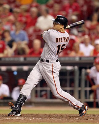 CINCINNATI, OH - JULY 30:  Carlos Beltran #15 of the San Francisco hits a pitch during the game against the Cincinnati Reds at Great American Ball Park on July 30, 2011 in Cincinnati, Ohio.  (Photo by Andy Lyons/Getty Images)