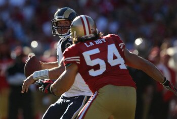 SAN FRANCISCO - NOVEMBER 14:  Sam Bradford #8 of the St. Louis Rams passes against Travis LaBoy #54 of the San Francisco 49ers during an NFL game at Candlestick Park on November 14, 2010 in San Francisco, California.(Photo by Jed Jacobsohn/Getty Images)