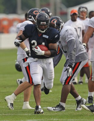 BOURBONNAIS, IL - AUGUST 06:  Marion Barber #24 of the Chicago Bearsruns with the ball during a summer training camp practice at Olivet Nazarene University on August 6, 2011 in Bourbonnais, Illinois.  (Photo by Jonathan Daniel/Getty Images)