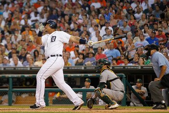 DETROIT - JULY 19: Miguel Cabrera #24 of the Detroit Tigers hits a two run home run in the fifth inning scoring Brennan Boesch #26 during the game against the Oakland Athletics at Comerica Park on July 19, 2011 in Detroit, Michigan.  (Photo by Leon Halip/