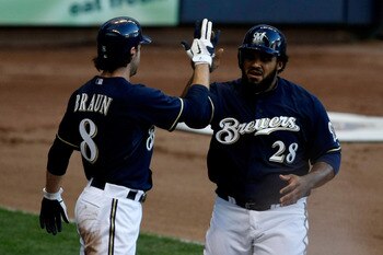 MILWAUKEE, WI - JULY 26: Prince Fielder #28 of the Milwaukee Brewers is congratulated by teammate Ryan Braun #8 after scoring against the Chicago Cubs at Miller Park on July 26, 2011 in Milwaukee, Wisconsin. (Photo by Scott Boehm/Getty Images)