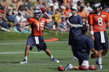 ENGLEWOOD, CO - JULY 28:  (L-R) Tim Tebow #15 and quarterback Kyle Orton #8 of the Denver Broncos take part in training camp at the Paul D. Bowlen Memorial Broncos Centre at Dove Valley on July 28, 2011 in Englewood, Colorado.  (Photo by Doug Pensinger/Ge