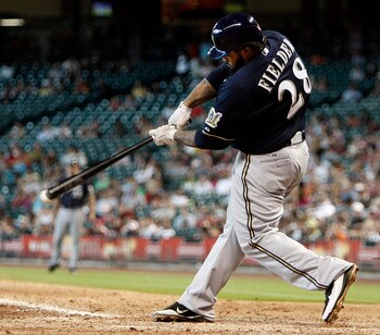 HOUSTON - AUGUST 07:  Prince Fielder #28 of the Milwaukee Brewers singles to right field in the fifth inning against the Houston Astros at Minute Maid Park on August 7, 2011 in Houston, Texas. Milwaukee won 7-3.  (Photo by Bob Levey/Getty Images)