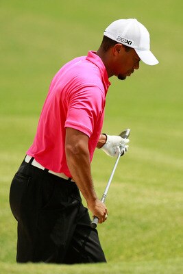 JOHNS CREEK, GA - AUGUST 11:  Tiger Woods reacts after hitting out of the bunker on the ninth hole during the first round of the 93rd PGA Championship at the Atlanta Athletic Club on August 11, 2011 in Johns Creek, Georgia.  (Photo by Kevin C. Cox/Getty I