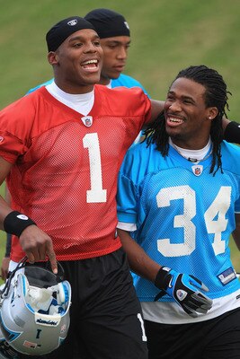 SPARTANBURG, SC - JULY 30:  Teammates Cam Newton #1 and DeAngelo Williams #34 of the Carolina Panthers during training camp at Wofford College on July 30, 2011 in Spartanburg, South Carolina.  (Photo by Streeter Lecka/Getty Images)