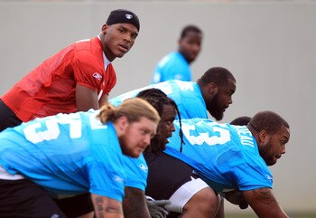 SPARTANBURG, SC - JULY 30:  Cam Newton #1 of the Carolina Panthers takes a snap from center during training camp at Wofford College on July 30, 2011 in Spartanburg, South Carolina.  (Photo by Streeter Lecka/Getty Images)