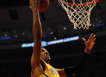 CHICAGO, IL - APRIL 26: Danny Granger #33 of the Indiana Pacers drives to the basket past Carlos Boozer #5 of the Chicago Bulls in Game Five of the Eastern Conference Quarterfinals in the 2011 NBA Playoffs at the United Center on April 26, 2011 in Chicago