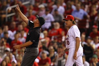 ST. LOUIS, MO - AUGUST 10: Umpire Greg Gibson #53 ejects manager Tony La Russa #10 of the St. Louis Cardinals from the game against the Milwaukee Brewers at Busch Stadium on August 10, 2011 in St. Louis, Missouri.  The Brewers beat the Cardinals 5-1.  (Ph